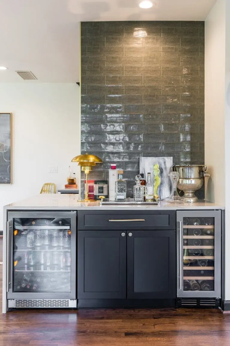 stylish home bar with dual wine and beverage coolers and glossy tile backsplash