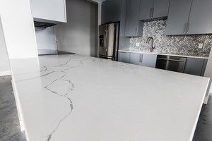 The kitchen countertops are simple yet stunning featuring Statuary Classique Quartz from MSI Surfaces which is elegant, durable, and requires no maintenance.