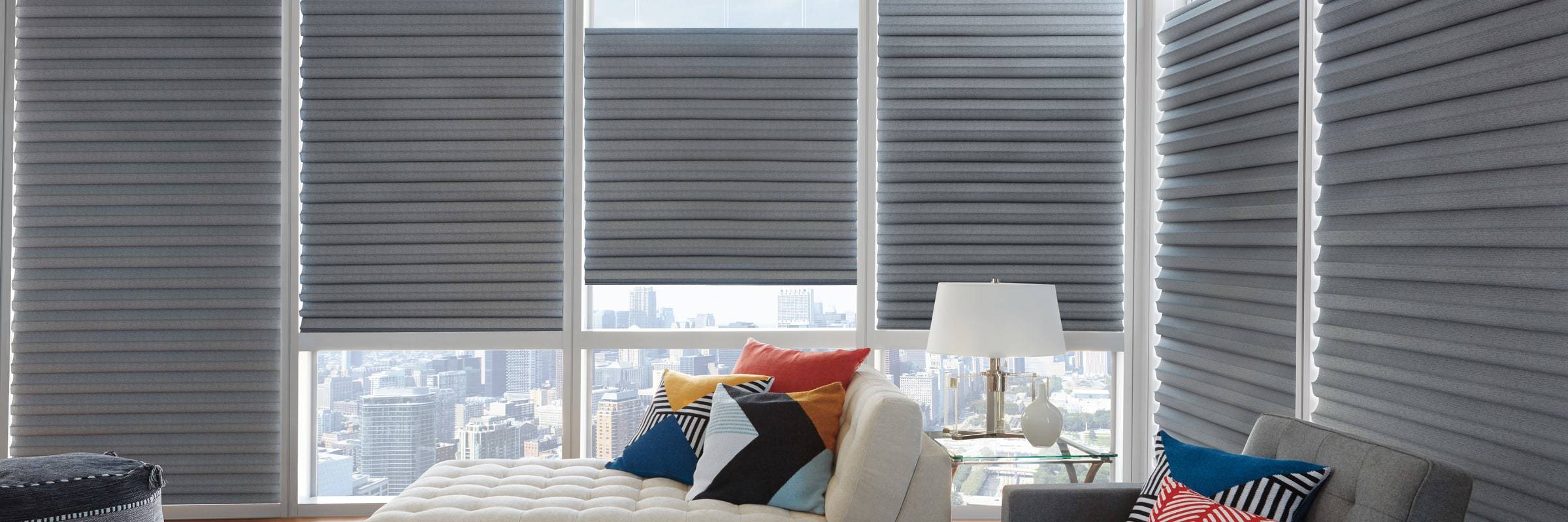 Made of woven and non-woven fabrics, Solera® Soft Shades create a fluid, sculpted look. It is a soft shade with cellular construction available in both light-filtering and room-darkening options. Learn more about Solera® Soft Shades.