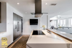 Kitchen Island in Dallas TX Penthouse After Remodeling by Renowned Renovation in The Travis at Katy Trail