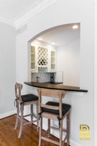 Wet Bar with Wine Rack in Highpark TX Single Family Home after Remodeling by Renowned Renovation