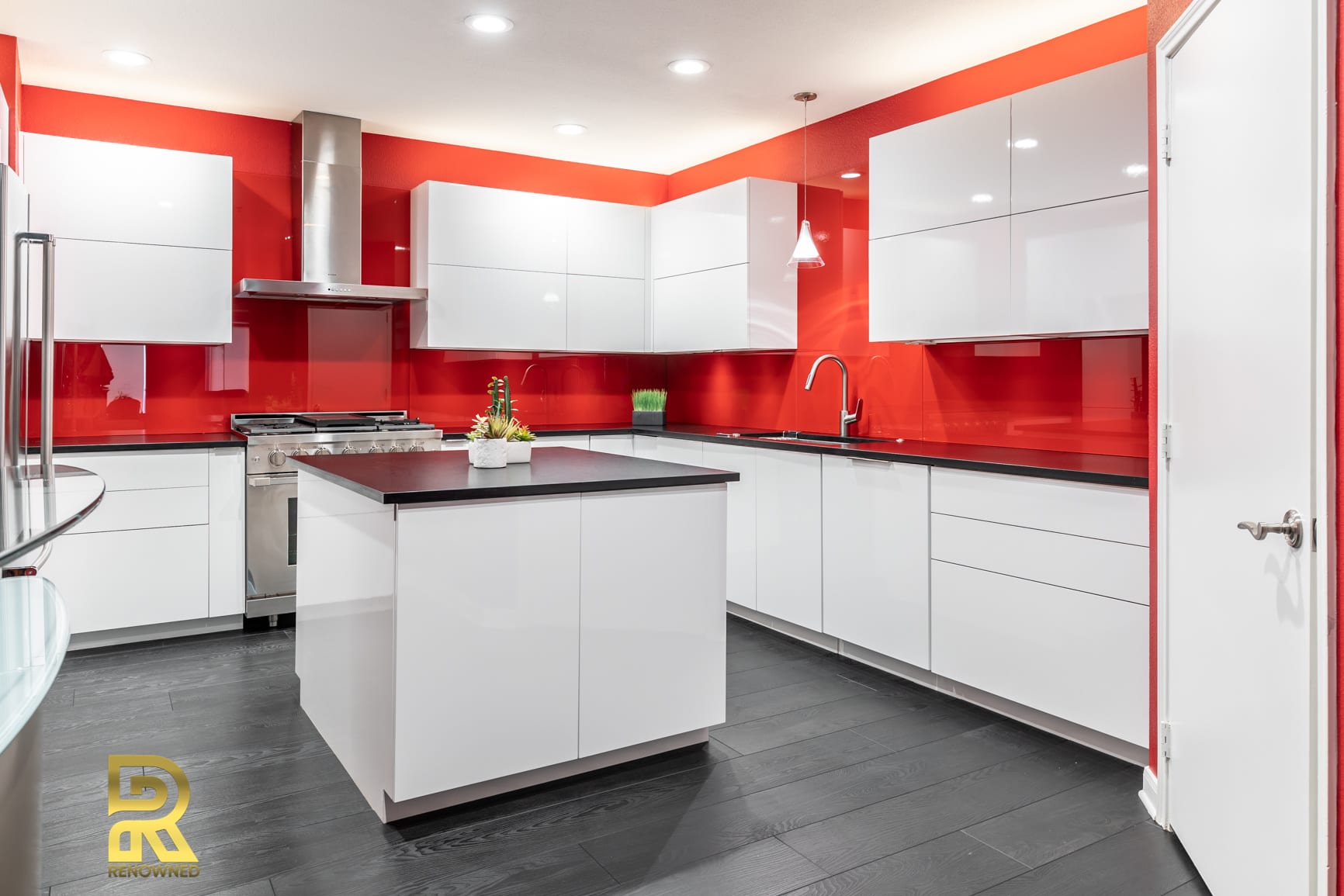 Red Hot Dallas High Rise Condo Kitchen with StyleCraft Cabinets After Remodeling by Renowned Renovation