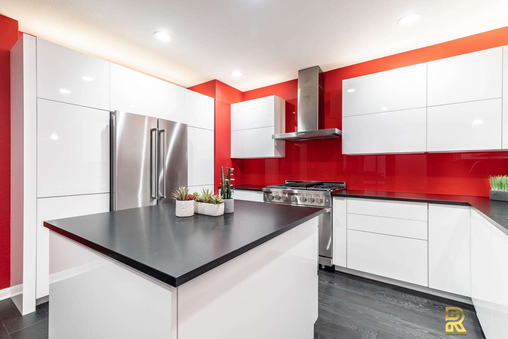 Red Hot Dallas High Rise Condo Kitchen with StyleCraft Cabinets After Remodeling by Renowned Renovation