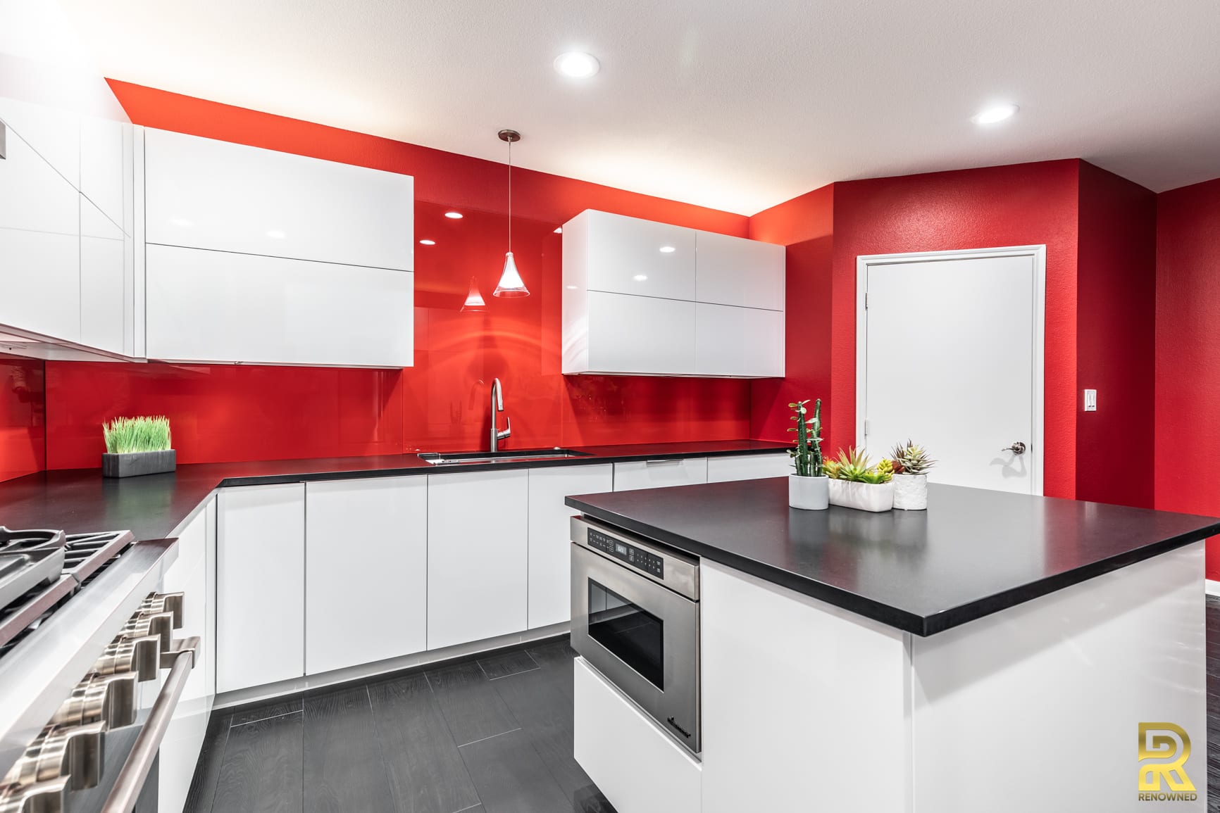 Red Hot Dallas High Rise Condo Kitchen with StyleCraft Cabinets After Remodeling by Renowned Renovation