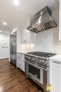 Luxury Kitchen Remodel Featuring Thermador Chimney Wall Hood