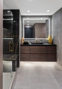 Guest bathroom vanity with sleek no-hardware design by StyleCraft Cabinets, Texas.