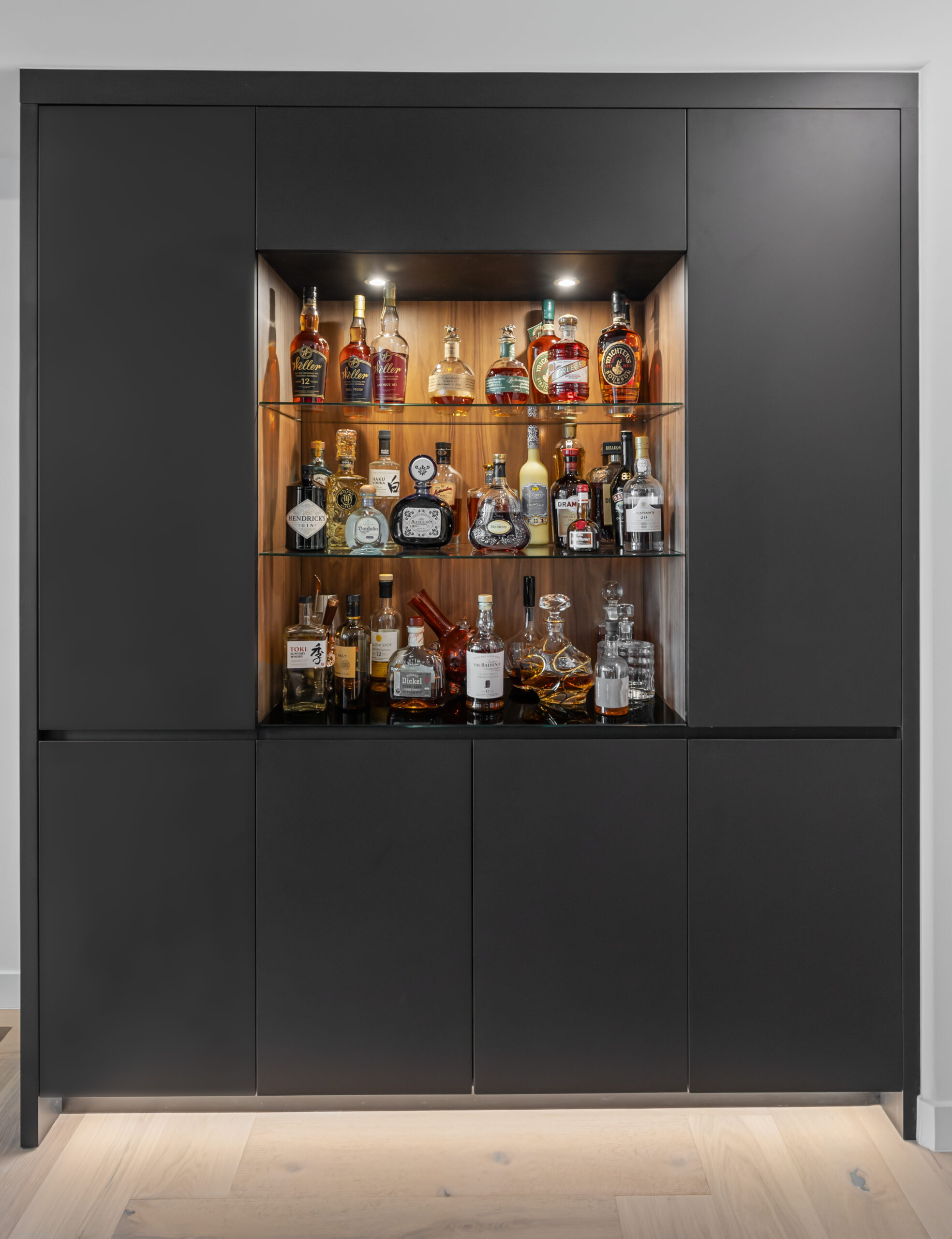 Custom wet bar with touch-access built-in ice maker and refrigerator drawer by StyleCraft in Dallas.