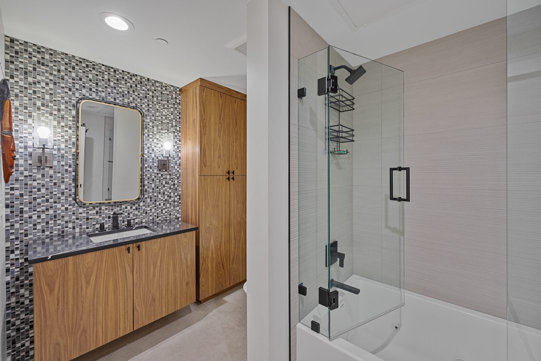 Guest bath shower after Conversionn of a Downtown Dallas Condo by Renowned Group