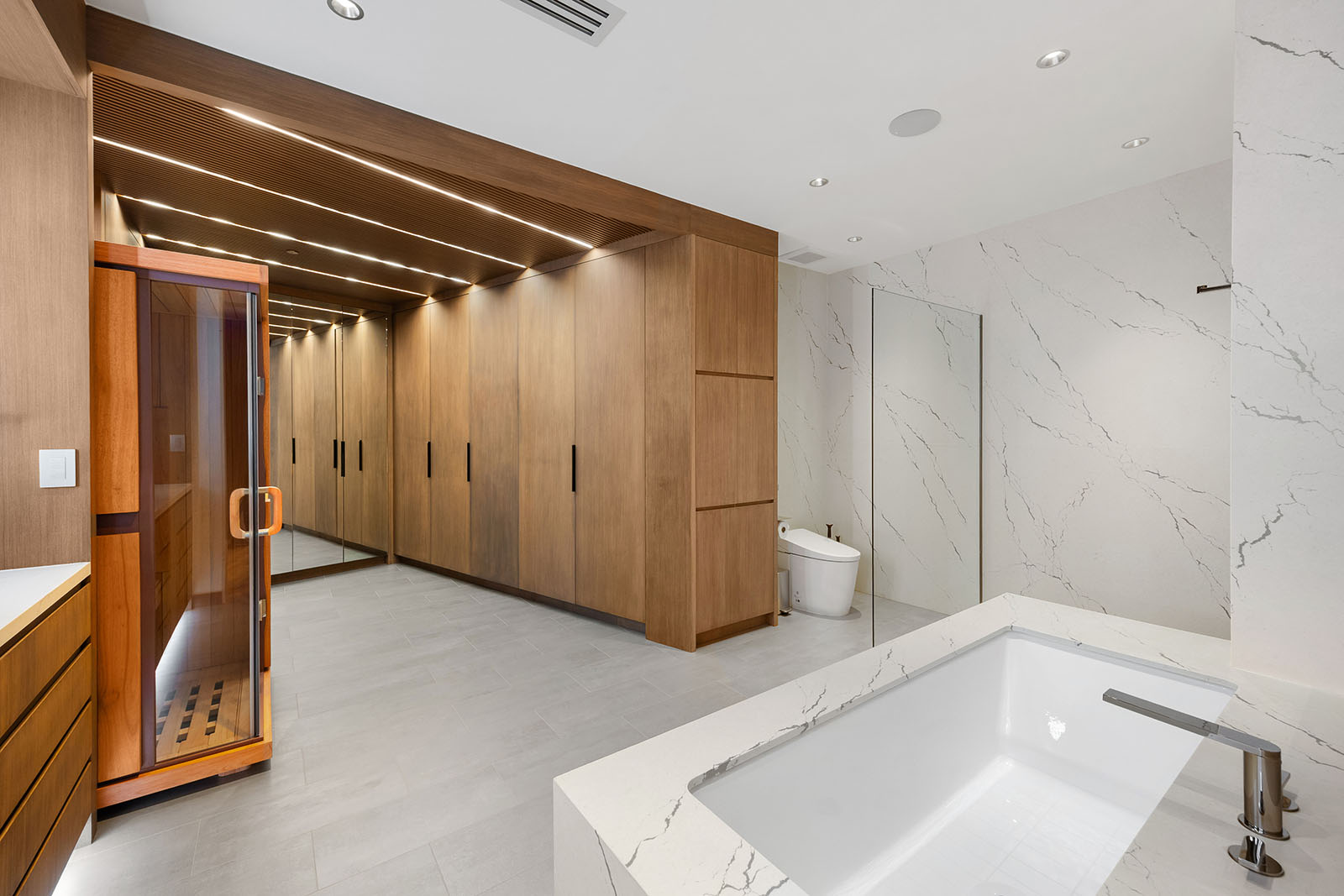Bathroom remodel in Dallas by Renowned Group wood paneled master bath with infrared sauna and soaking tub