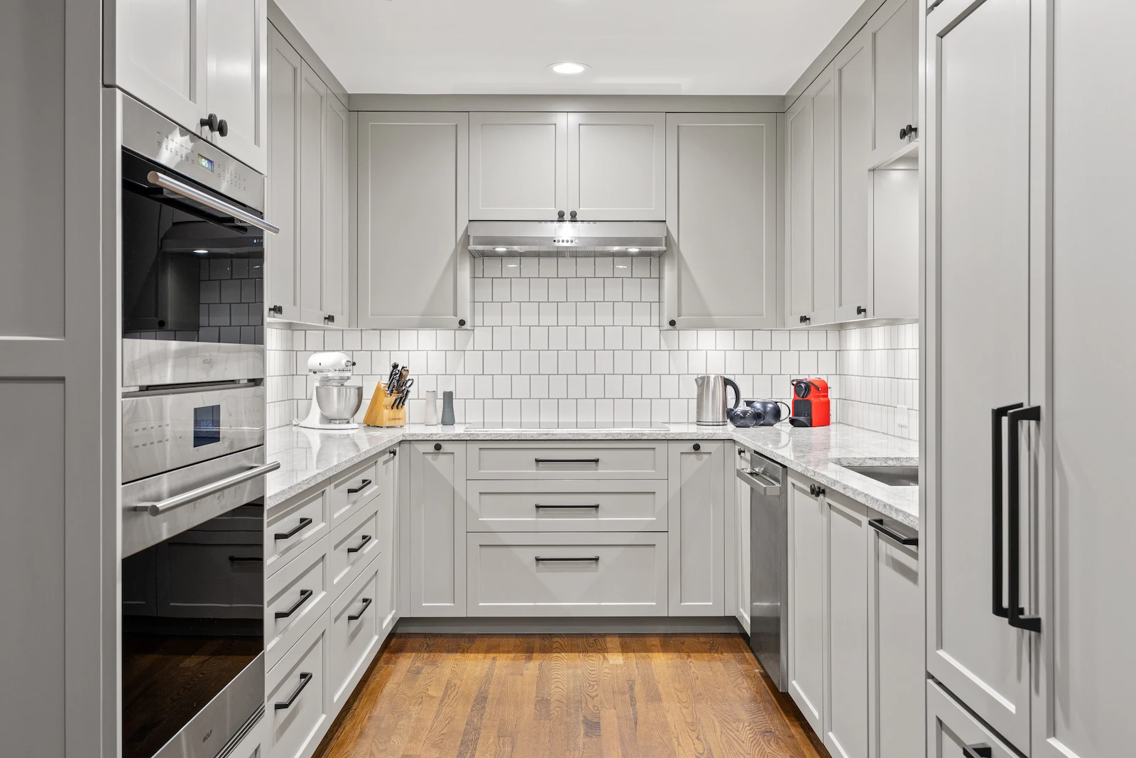 Dallas kitchen remodel by Renowned Group white shaker cabinets with subway tile backsplash