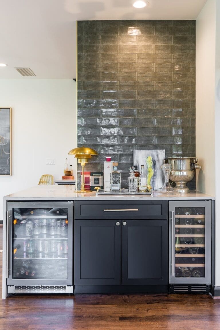 stylish home bar with dual wine and beverage coolers and glossy tile backsplash